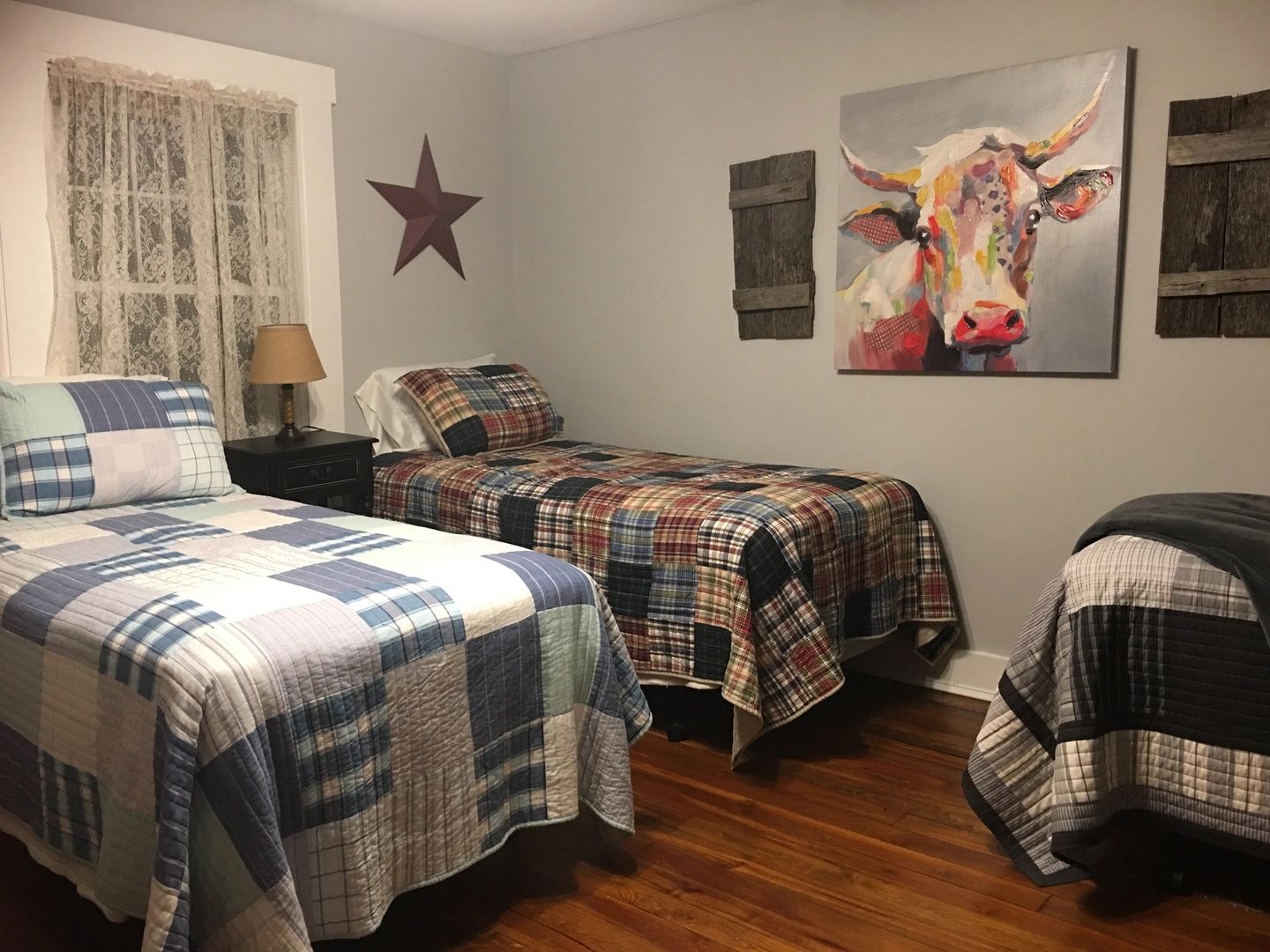 Rustic bedroom with plaid quilts