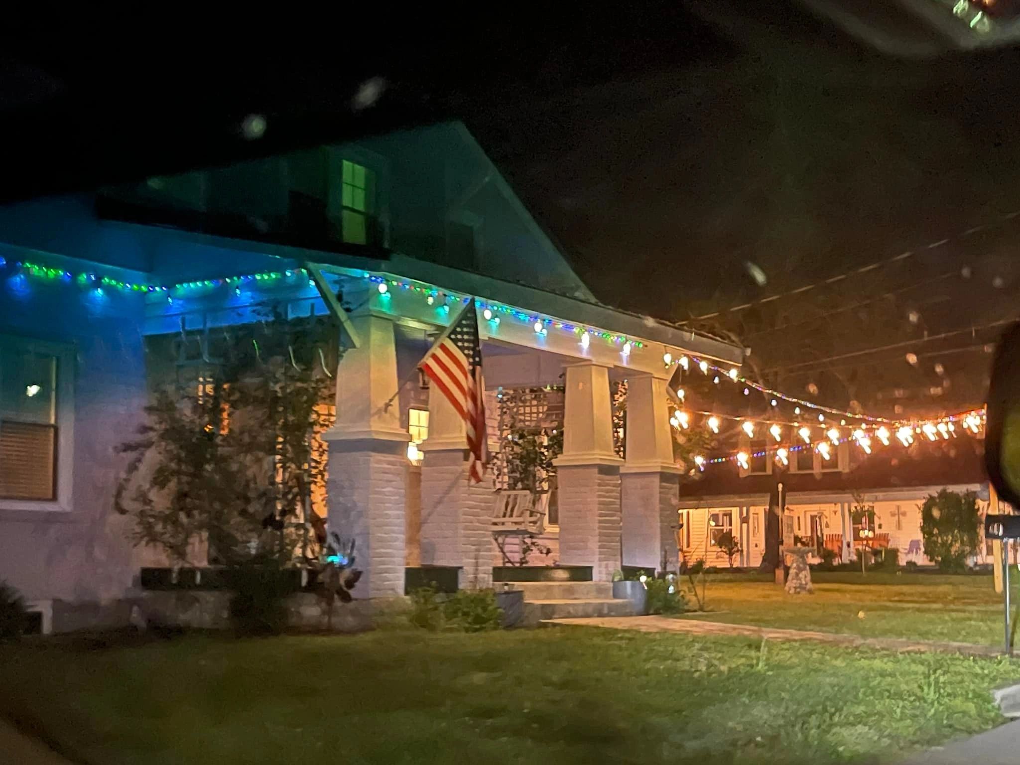 House exterior at night with lights