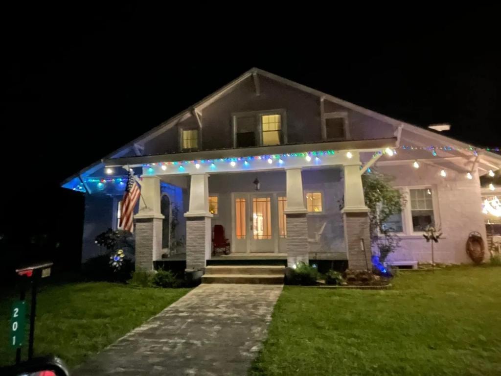 Hinkle Hill Inn front porch with holiday lights at night