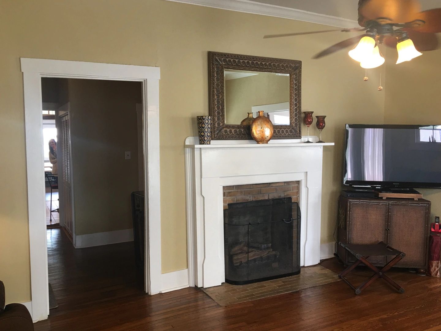 Living room with white fireplace