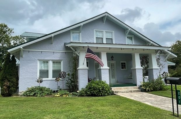 Hinkle Hill Inn cottage with porch and American flag